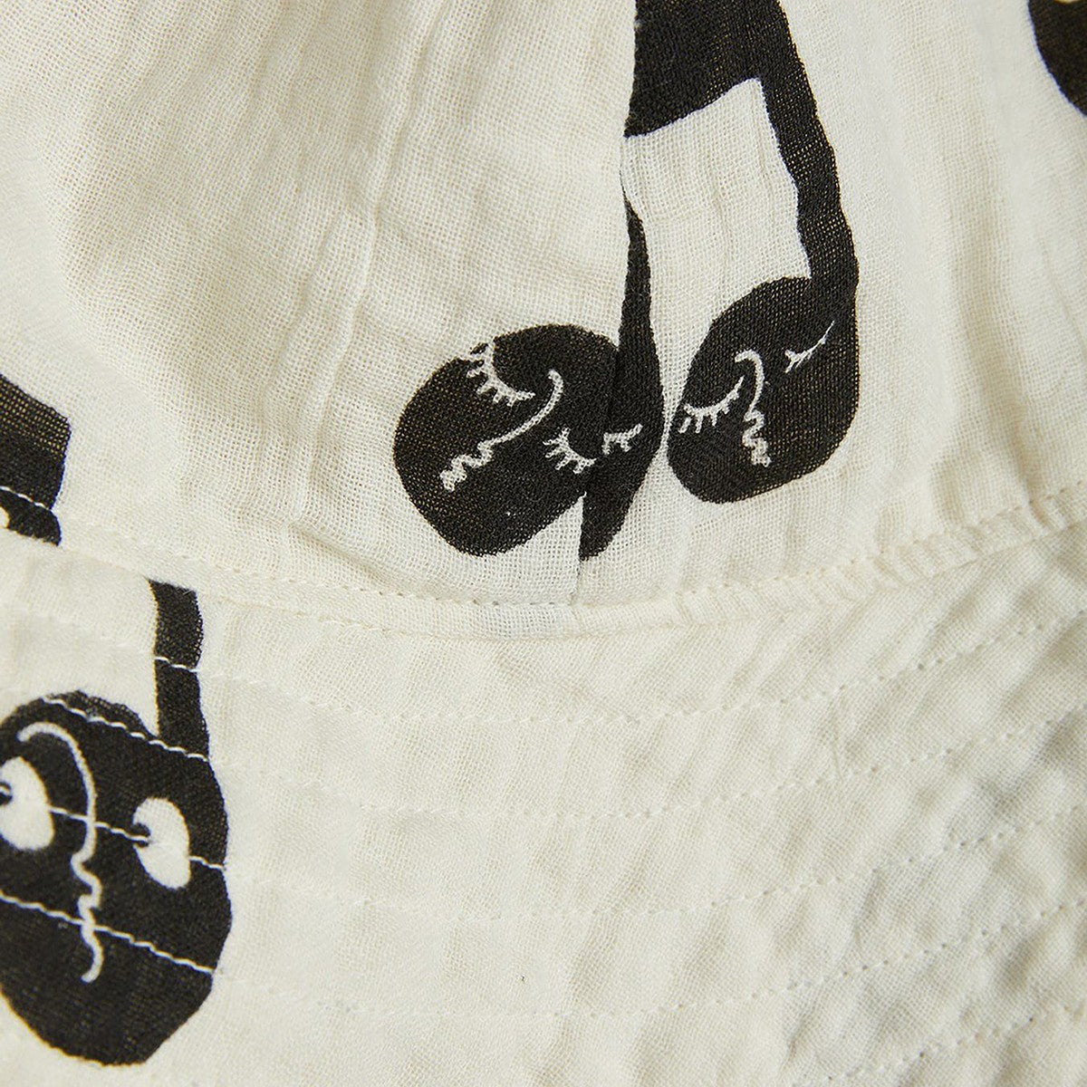 Mini Rodini White hat with musical notes Mini Rodini