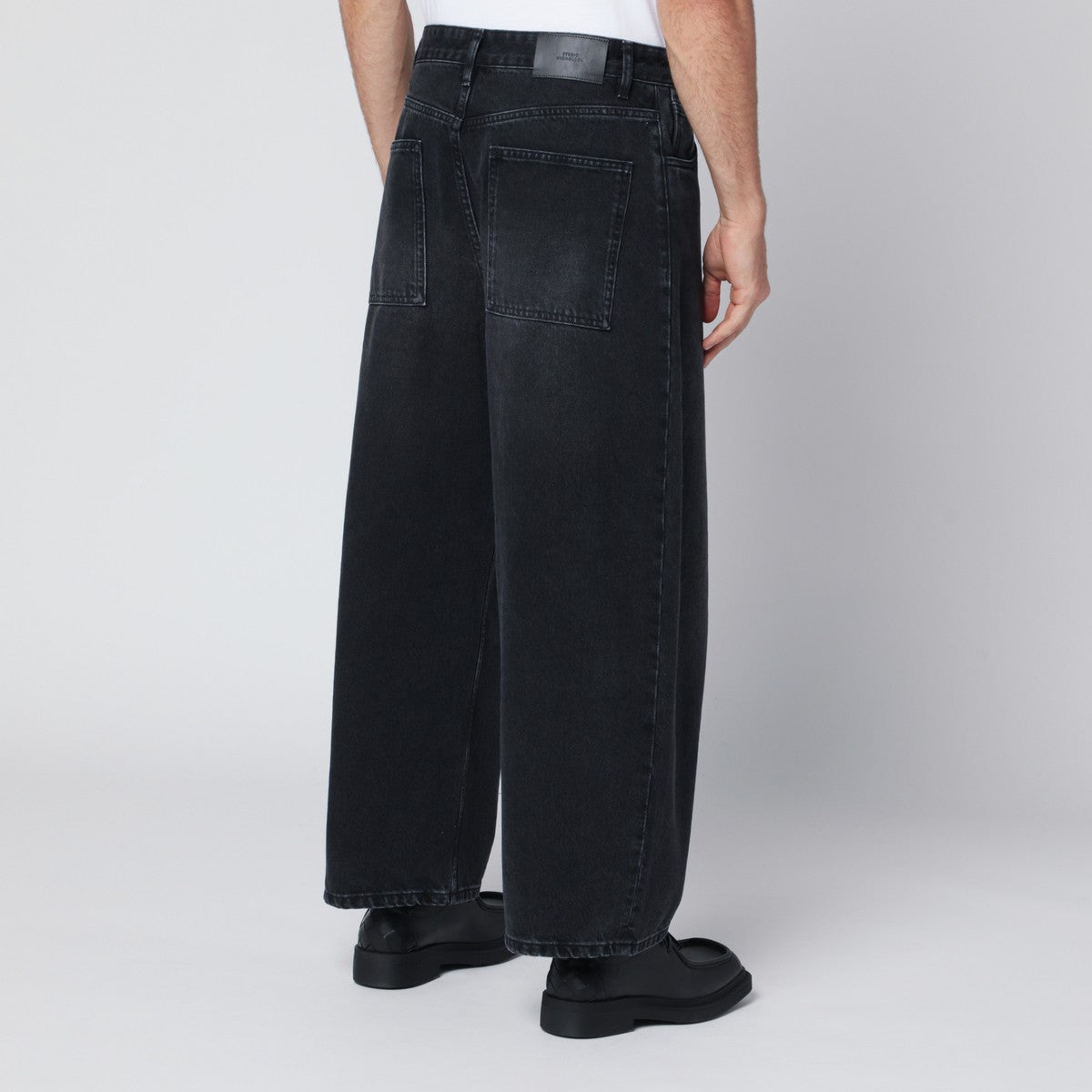STUDIO NICHOLSON Wide-leg washed black jeans Studio Nicholson